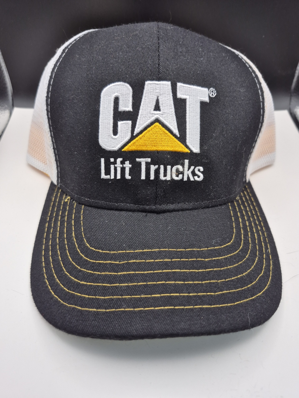 CAT Lift Trucks Black & White Mesh Trucker Hat with Yellow Accent